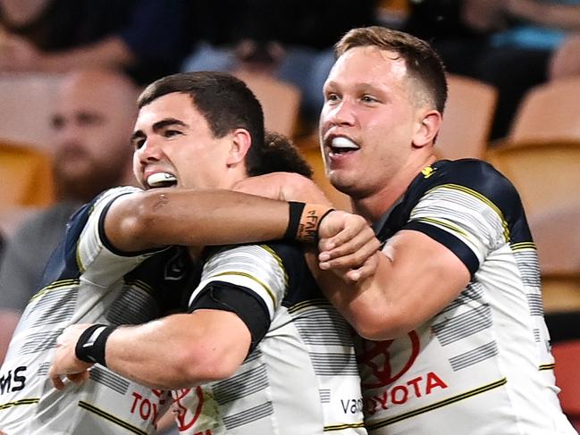 BRISBANE, AUSTRALIA - SEPTEMBER 24: Jake Clifford of the Cowboys celebrates scoring a try during the round 20 NRL match between the Brisbane Broncos and the North Queensland Cowboys at Suncorp Stadium on September 24, 2020 in Brisbane, Australia. (Photo by Bradley Kanaris/Getty Images)