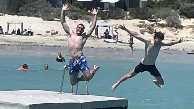 Visitors enjoy the Robe swimming pontoon, which is back in the water after insurance woes threatened to beach it for the first summer in 52 years. Lachlan Parker (left) and Oliver Knight (right)