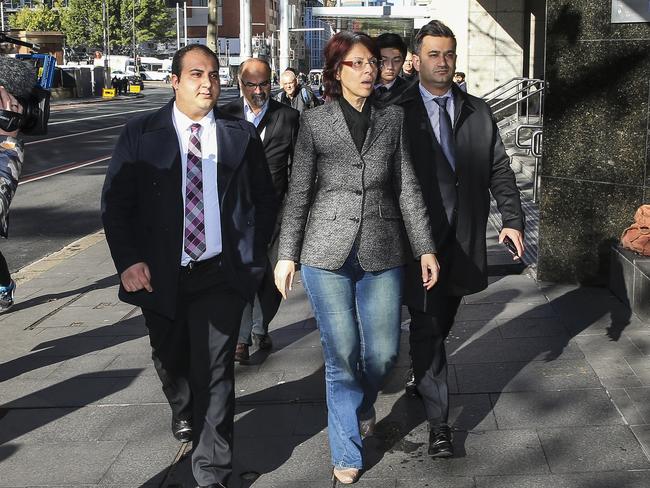 Eman Sharobeem (centre) is accused of using more than $680,000 of public money. Picture: Dylan Robinson