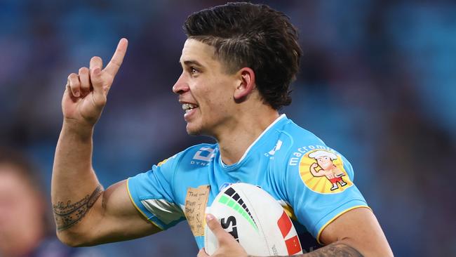 GOLD COAST, AUSTRALIA - JULY 30: Jayden Campbell  of the Titans celebrates a try during the round 22 NRL match between Gold Coast Titans and North Queensland Cowboys at Cbus Super Stadium on July 30, 2023 in Gold Coast, Australia. (Photo by Chris Hyde/Getty Images)