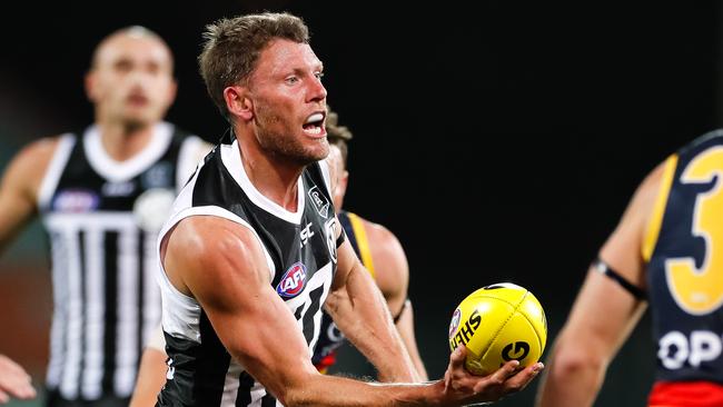 ADELAIDE, AUSTRALIA - JUNE 13: Brad Ebert of the Power handballs during the round 2 AFL match between the Port Adelaide Power and the Adelaide Crows at Adelaide Oval on June 13, 2020 in Adelaide, Australia. (Photo by Daniel Kalisz/Getty Images)