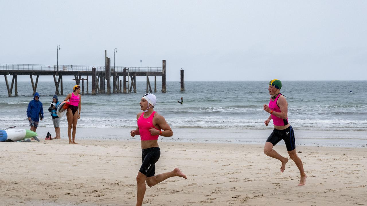 Wet weather at a competitive Surf Life Saving event at Glenelg Beach on Saturday. Picture: Morgan Sette