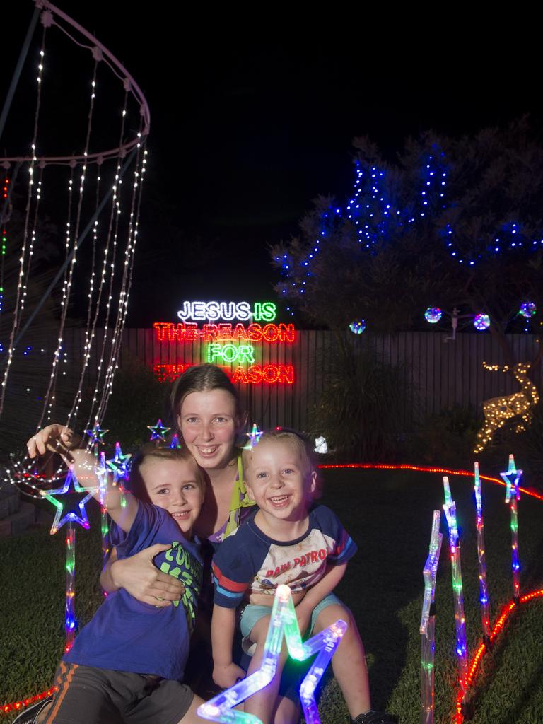 Natasha Horder with sons Noah (left) and Xavier Horder have fun at John Gamble's Grant Cl entry of Toowoomba Christmas Lights Competition, Friday, December 11, 2015. Photo Kevin Farmer / The Chronicle