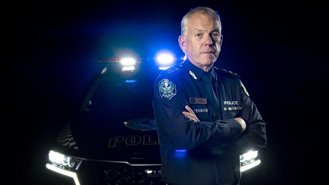 Police Commissioner Grant Stevens poses in front of Police Car lights Monday December ,13,2021.Picture Mark Brake