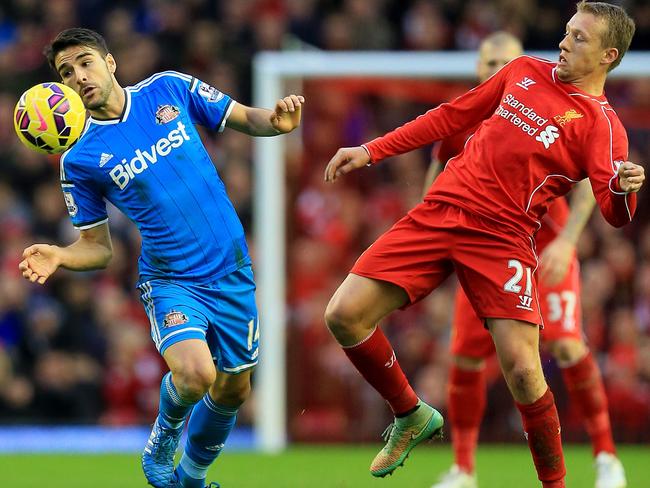 Jordi Gomez tries to keep Lucas Leiva at bay.