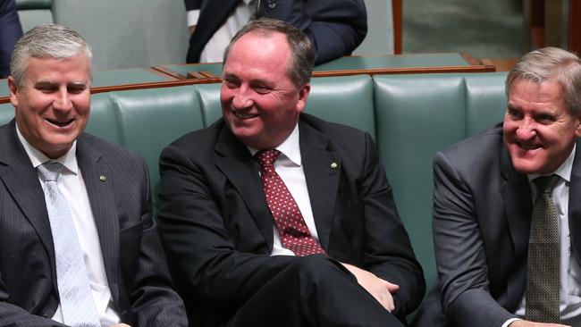 Nationals MP Michael McCormack, Nationals MP  Barnaby Joyce and Ian Macfarlane during a Division in the House of Representatives Chamber at Parliament House in Canberra.