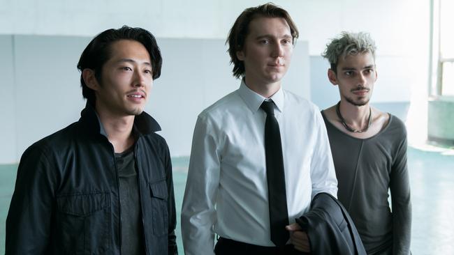 Steven Yeun in Okja with Paul Dano and Devon Bostick.