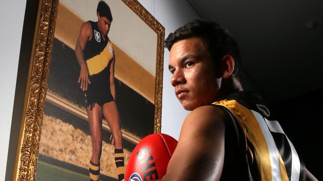 Daniel Rioli with a portrait of his grand uncle Maurice. Picture: Tim Carrafa