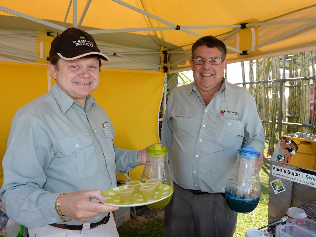 Canegrowers manager Kerry Latter and board director Kevin Borg with samples of sugar cane juice at the Sarina Show. Photo Lee Constable / Daily Mercury