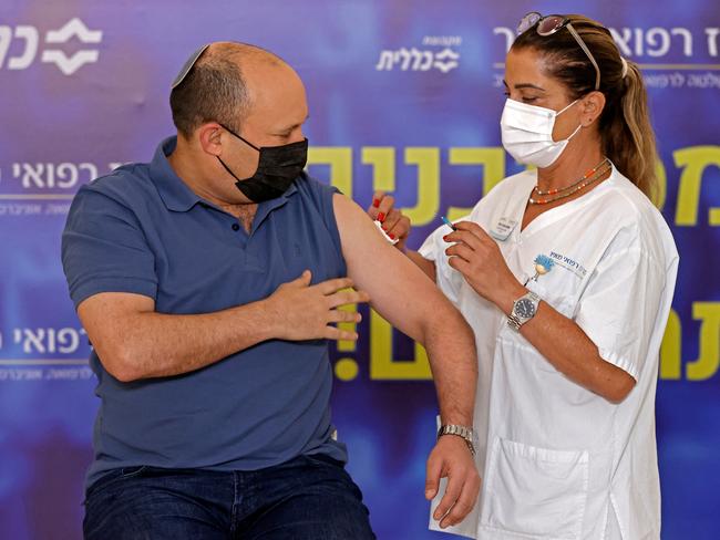 Israeli Prime Minister Naftali Bennett receives a booster shot of vaccine against coronavirus in the central Israeli city of Kfar Saba on 20 August. Picture: AFP