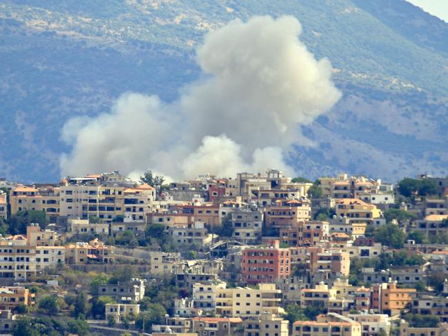 TOPSHOT - Smoke billows from the site of an Israeli airstrike in the southern Lebanese village of Khiam near the border on September 19, 2024. Lebanon's Hezbollah has traded near-daily fire with Israeli forces in support of ally Hamas since the Palestinian militant group's October 7 attack triggered war in the Gaza Strip, with repeated escalations during more than 11 months of the cross-border violence. (Photo by AFP)