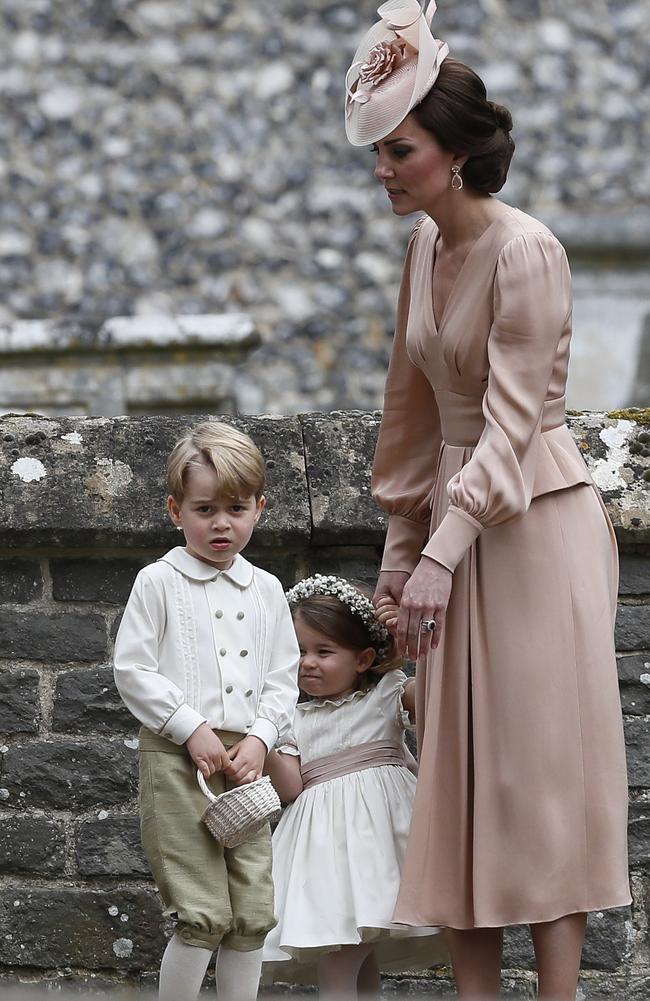 Catherine, Duchess of Cambridge, right, stands with Princess Charlotte and Prince George, who were flower boys and girls at the wedding of Pippa Middleton and James Matthews. Picture: Getty