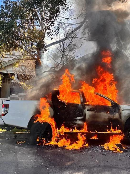 A white Toyota Hilux getaway car was set on fire in Dulwich Hill. Picture: TNV