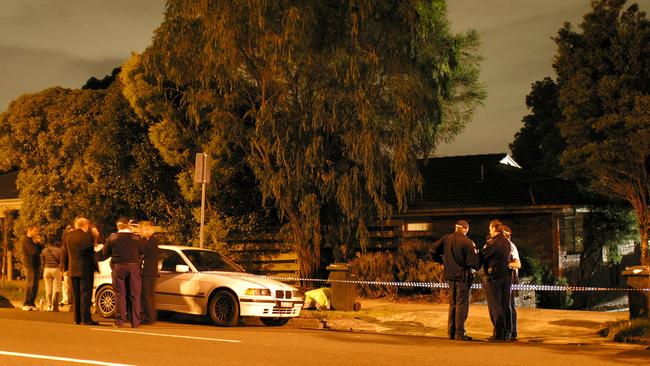 Police at the murder scene of Terence and Christine Hodson in 2004.