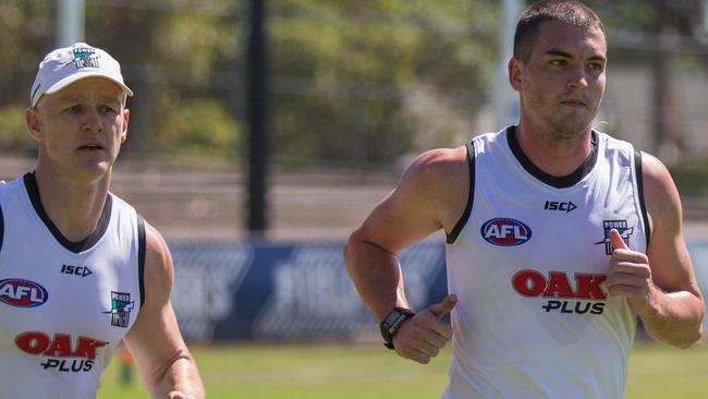 Gun recruit Tom Rockliff, right, will play in Port Adelaide's internal trial at Alberton Oval on Saturday but Robbie Gray will miss. Picture: Ben Macmahon (AAP).