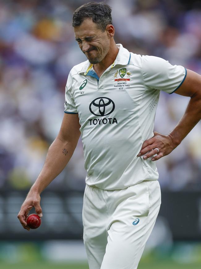 Mitchell Starc grabs at his side on day three. Picture: Michael Klein