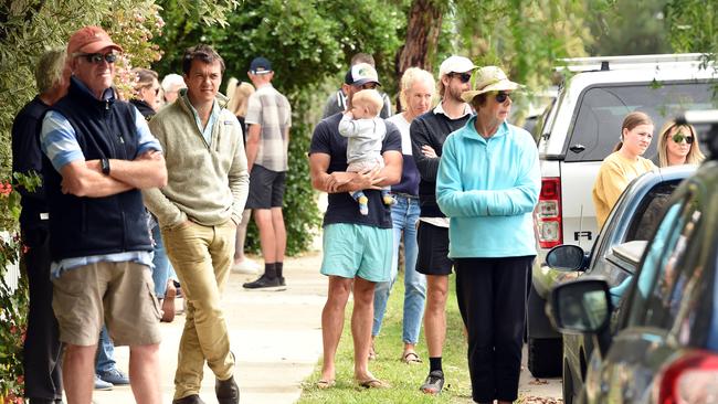 Crowds stood silent at some Geelong auctions.