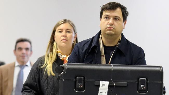 Brittany Higgins and her fiance David Sharaz arriving in Paris before starting their new life in France., The couple were photographed wearing all-black outfits as they arrived on Tuesday evening at Charles de Gaulle airport where they collected suitcases and luggage. Picture: KCS Presse / MEGA