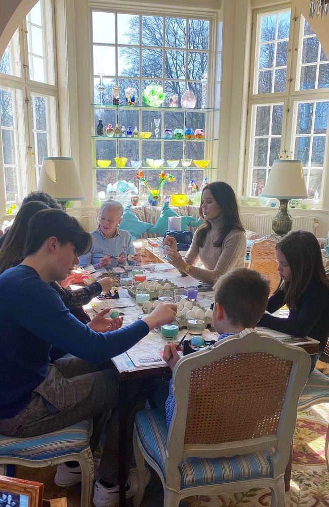 The whole family sit down to paint eggs for Easter. Picture: Kongehuset