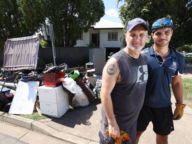 Nigel and Sam Bean cleaning up at their Fairfield home. Picture: Liam Kidston