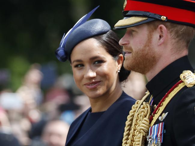 FILE - In this Saturday, June 8, 2019 file photo, Britain's Meghan, the Duchess of Sussex and Prince Harry ride in a carriage to attend the annual Trooping the Colour Ceremony in London. Kensington Palace says on Thursday, June 20 the Duke and Duchess of Sussex will be starting their own foundation to support their charitable endeavors, formally spinning off from the entity Prince Harry and Prince William established together a decade ago. (AP Photo/Frank Augstein, file)