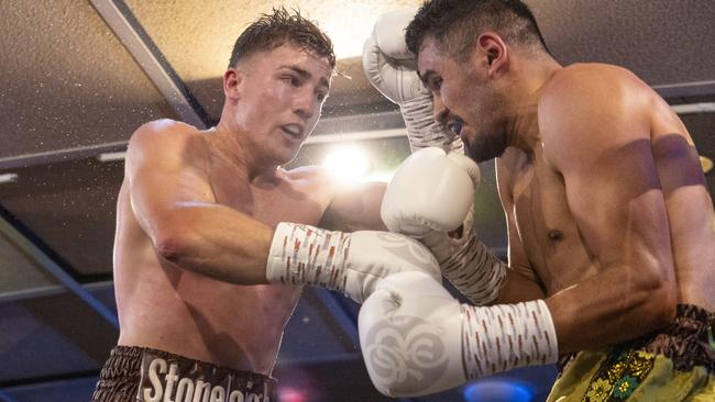 Jackson Griffiths and Miguel Vazquez trade blows during the WBC Australasia Grand Champion title fight between the pair. Picture: Darren Burns