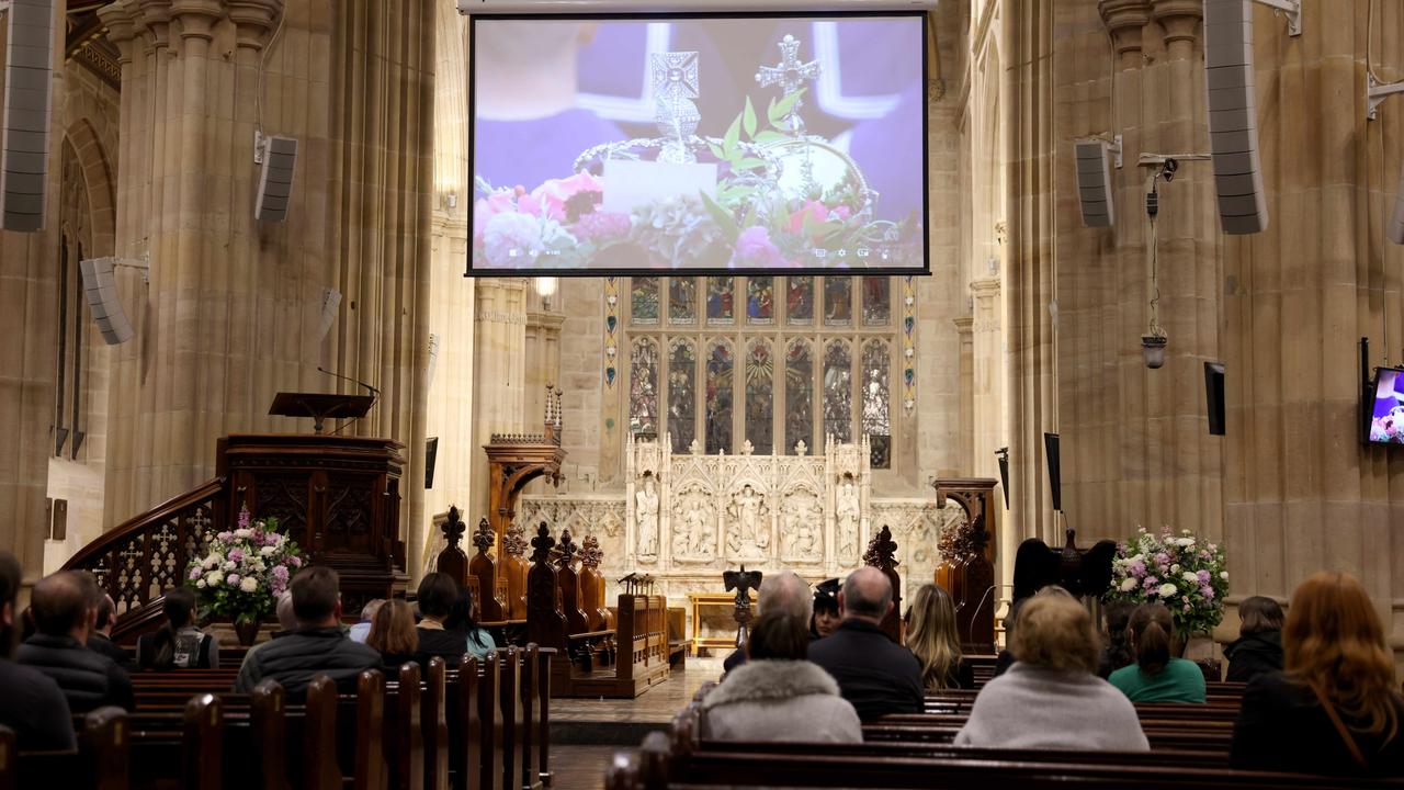 Sydney, Australia: People watch a livestream of Queen Elizabeth’s funeral at St Andrews Church, Sydney CBD. Picture: Damian Shaw