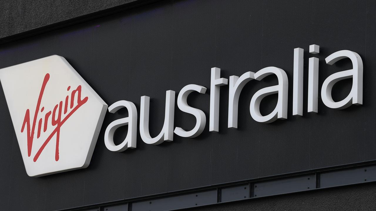 Signage for Virgin Australia is seen at Melbourne Airport in Melbourne on Monday. Picture: James Ross