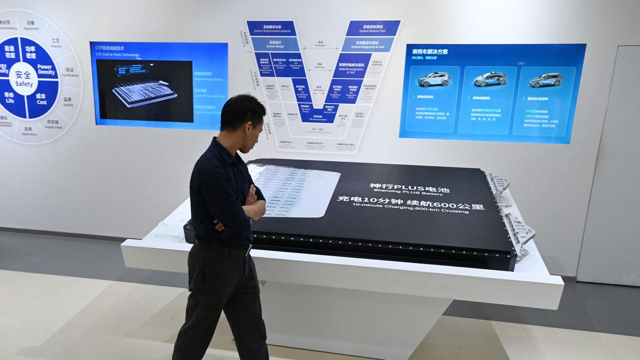 A visitor looks at a Shenxing Plus battery pack for electric vehicles in the showroom at the headquarters of Chinese EV battery maker CATL in southeast China’s Fujian province. Picture: Greg Baker / AFP