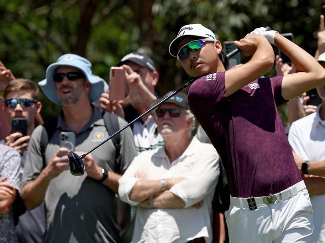 Members of the crowd watch Australia'&#128;&#153;s Min Woo Lee hit a shot during the second round of the Australian Open golf tournament at The Australian Golf Club in Sydney on December 1, 2023. (Photo by DAVID GRAY / AFP) / — IMAGE RESTRICTED TO EDITORIAL USE – STRICTLY NO COMMERCIAL USE —