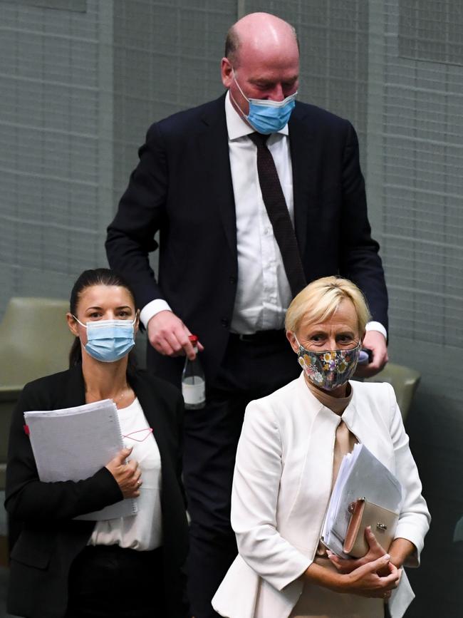 Liberal member for Higgins Katie Allen (right), Liberal member for North Sydney Trent Zimmerman (top) and Liberal member for Reid Fiona Martin (left) all crossed the floor to vote in favour of an amendment to enshrine the protection of trans kids in the religious discrimination bill, Thursday, February 10, 2022. (AAP Image/Lukas Coch) NO ARCHIVING