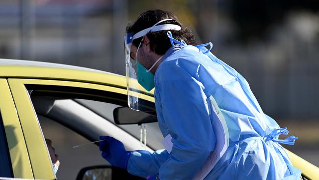 Health workers dressed in Personal Protection Equipment (PPE) conduct COVID-19 tests at the new 24/7 Fairfield West Laverty Pathology Pop-up Drive-through clinic, in Sydney. Picture: NCA NewsWire/Bianca De Marchi