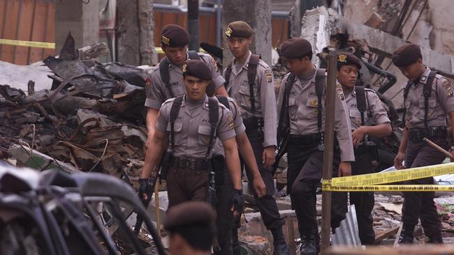 Indonesian police officers at the scene of the Bali bombings in Kuta. Picture: Getty Images