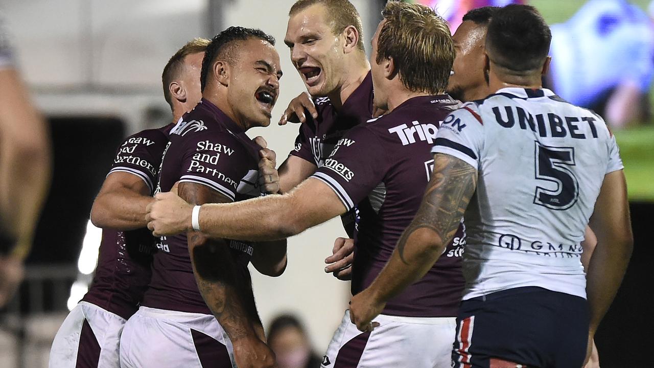 MACKAY, AUSTRALIA – SEPTEMBER 17: Dylan Walker of the Sea Eagles celebrates with teammates after scoring a try during the NRL Semi-Final match between the Manly Sea Eagles and the Sydney Roosters at BB Print Stadium on September 17, 2021 in Mackay, Australia. (Photo by Matt Roberts/Getty Images)