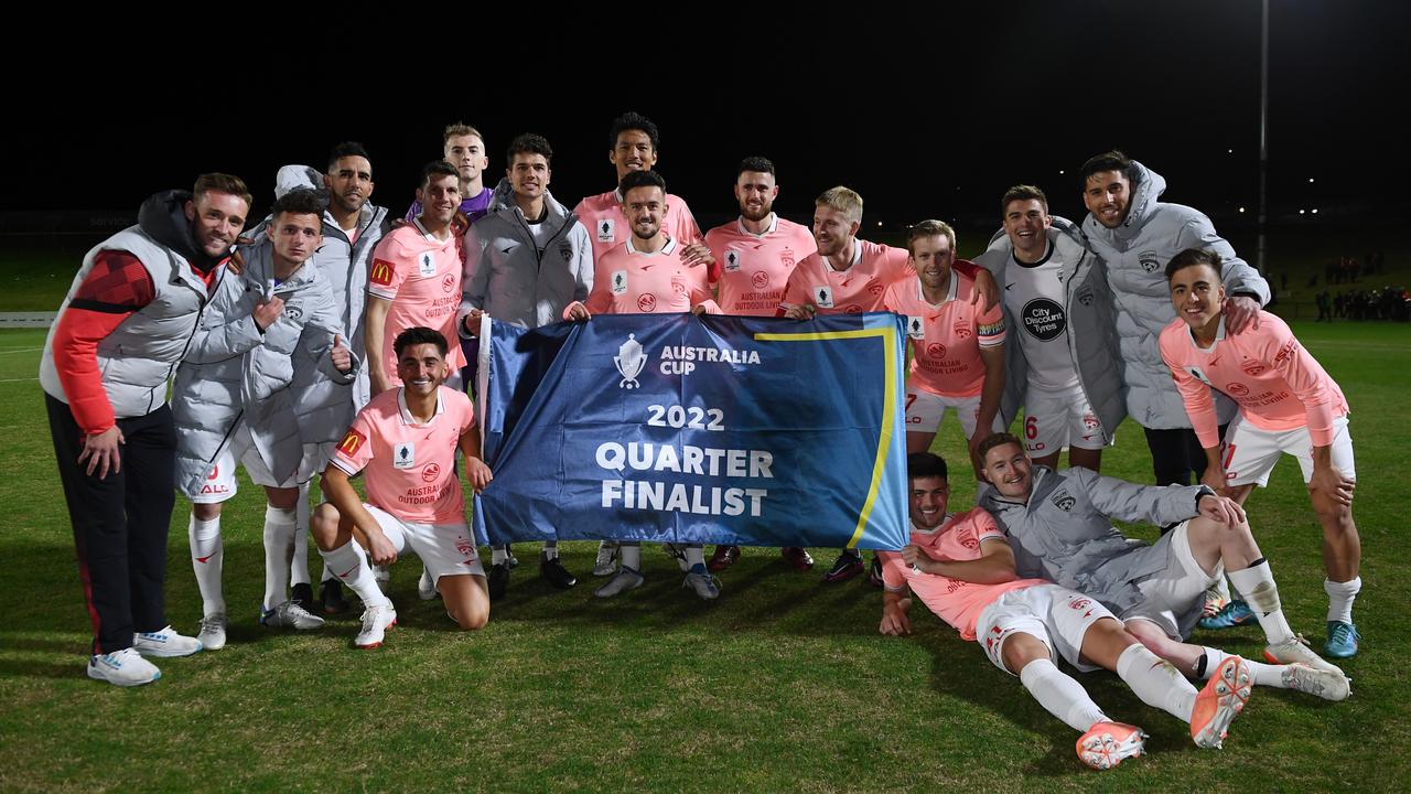 Adelaide United players rejoice after reaching the Australia Cup quarter-finals. Picture: Mark Brake/Getty Images