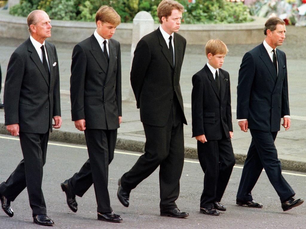 <b>1997:</b> Prince Harry suffers the unimaginable loss of his mother, Princess Diana, after her death in a tragic car crash in Paris. In a move that would prove controversial, senior royals decide that Prince Harry and his elder brother should walk behind their mother’s coffin for part of the funeral procession towards Westminster Abbey. The heartbreaking sight of the young princes walking with their father, grandfather and uncle, is a defining image of the tragedy. Harry would later write in Spare that he felt “numb” during the walk but gained strength from his William, who he kept in sight despite keeping his eyes on the ground.