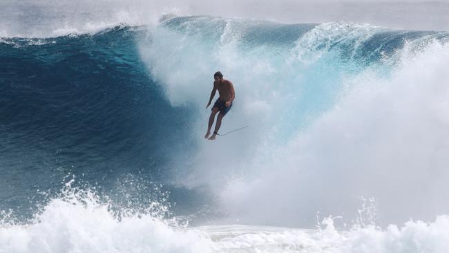 Surfers at Snapper Rocks and Kirra riding the Large swell produced by Cyclone OMA. Photograph : Jason O'Brien