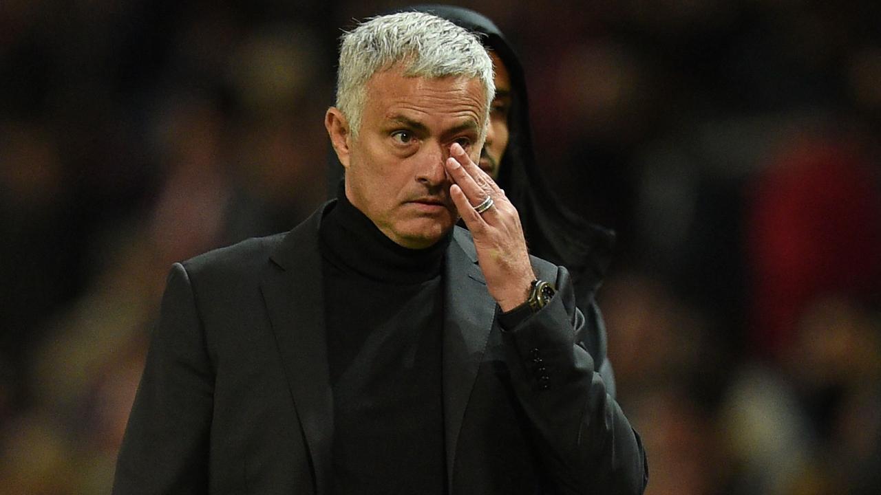 Manchester United's Portuguese manager Jose Mourinho leaves the pitch after the loss.