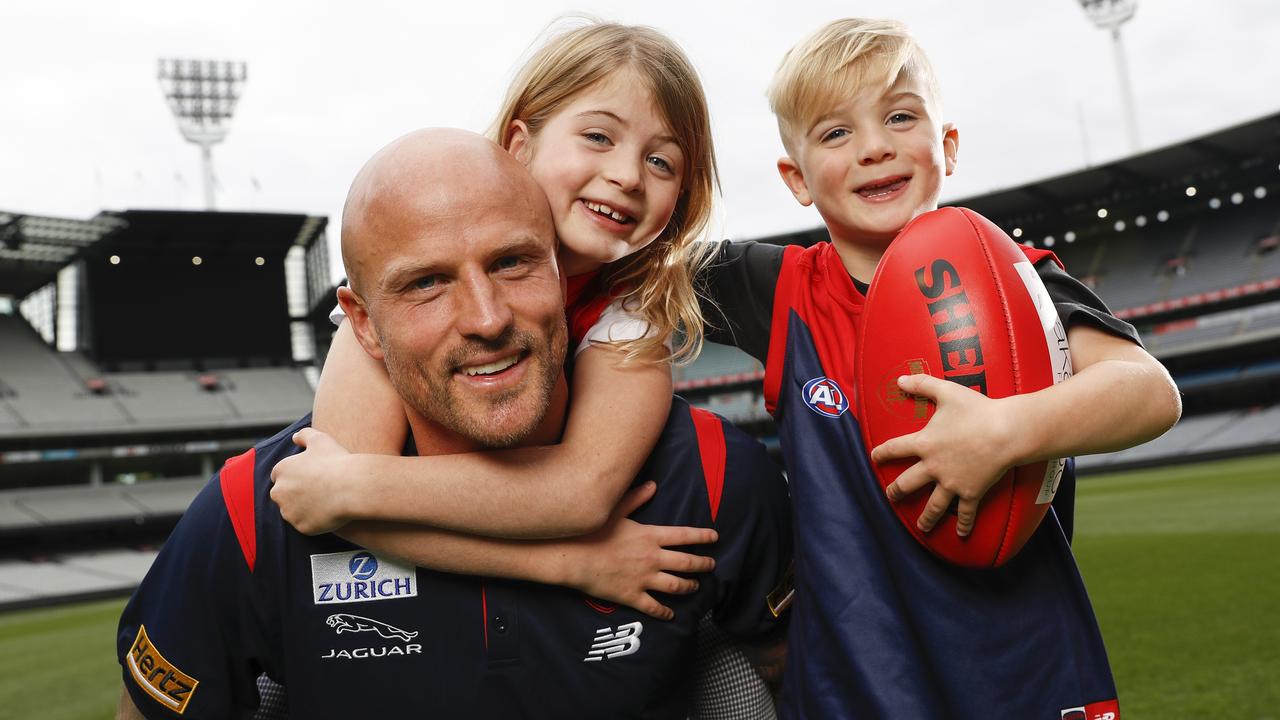 Nathan Jones of the Demons with his children, Bobby and Remy, ahead of his 300th game. Picture: Dylan Burns/AFL Photos via Getty Images