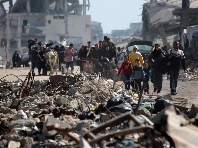Palestinians carry their belongings as they flee Gaza City. Picture: AFP