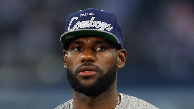 ARLINGTON, TX - SEPTEMBER 08:  NBA player Lebron James of the Miami Heat throws a football at AT&T Stadium before a Sunday night game between the New York Giants and the Dallas Cowboys on September 8, 2013 in Arlington, Texas.  (Photo by Ronald Martinez/Getty Images)