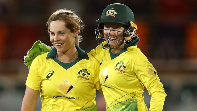 (L-R) Sophie Molineux and Alyssa Healy celebrate Twenty20 victory over New Zealand at Manuka Oval on October 5 in Canberra. Picture: Getty Images