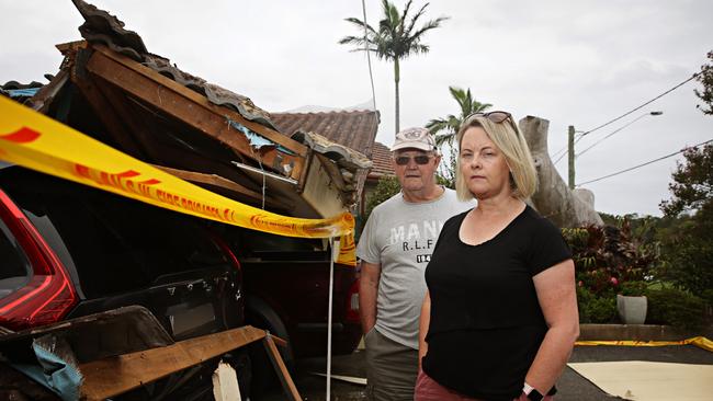 Debra Kasmar and her dad Bryan Page out the front of their collapsed carport. Picture: Adam Yip / Manly Daily