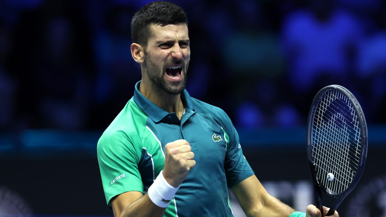 Novak Djokovic of Serbia celebrates winning match point against Jannik Sinner. Photo by Clive Brunskill/Getty Images.