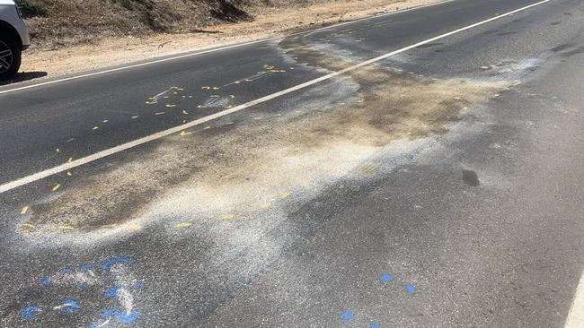 Dried oil stains and police markings were visible on Uley Rd after it reopened. Picture: George Yankovich