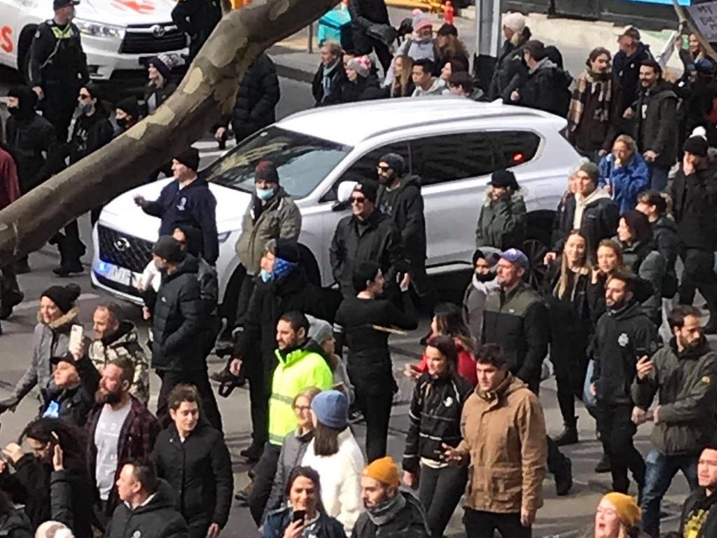 Huge crowds have also gathered in Melbourne’s CBD, many not wearing face masks. Picture: Michael Groppo