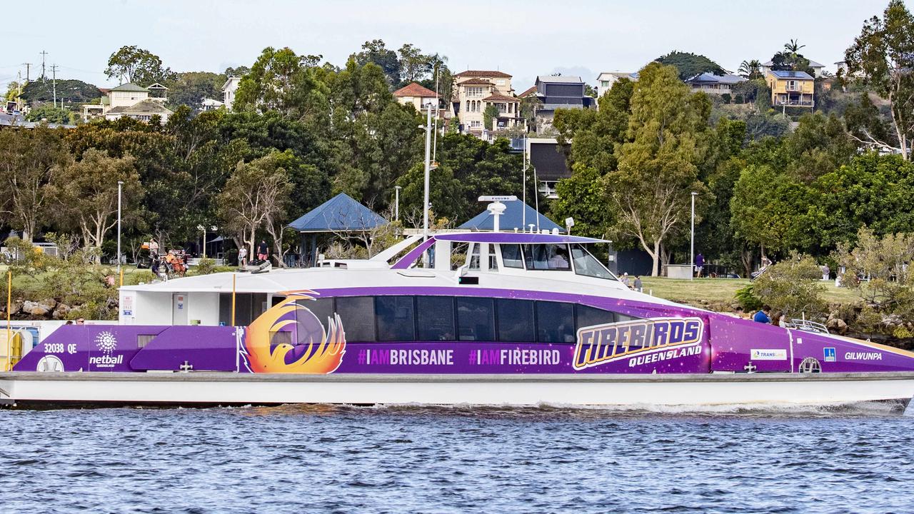 A Citycat zips past Bulimba riverfront homes. Picture: Richard Walker