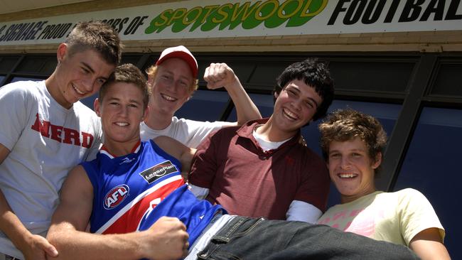 Giants midfielder Callan Ward, pictured with friends after being drafted from Spotswood in 2007, played the first 60 games of his career for the Western Bulldogs.