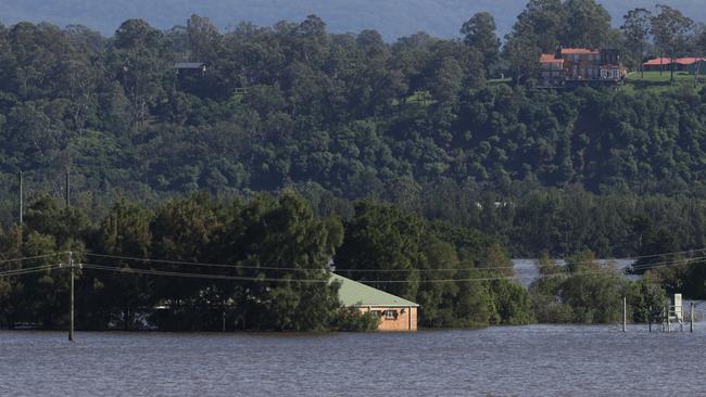 A house near the flooded Hawkesbury River in Richmond. Morningstar has warned on the profit outlook for the nation’s insurers as reinsurance costs are set to rise. Picture: NCA NewsWire/Damian Shaw