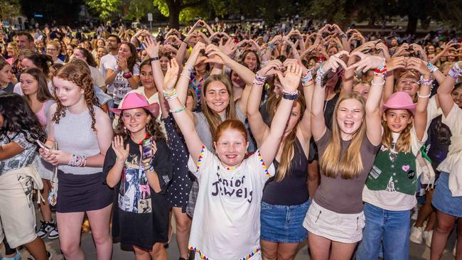 Taylor Swift fans enjoy the concert from outside the MCG. Picture: Jake Nowakowski